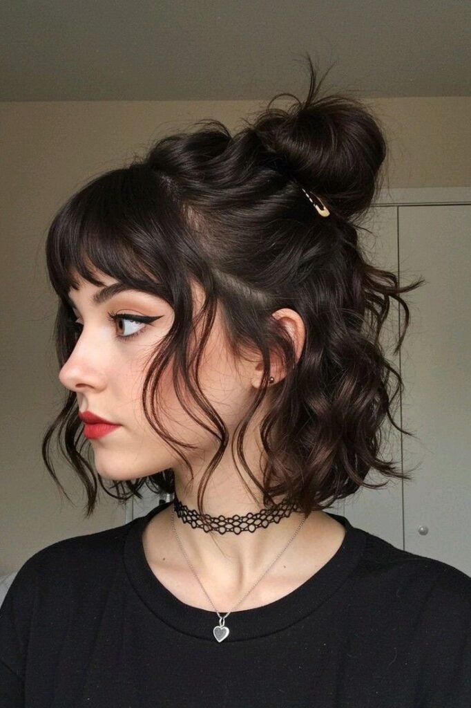 17. (Wavy Dark Brunette Half-Up Bun with Short Piecey Bangs)