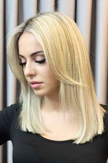 10. Straight Bright Blonde Lob with Face-Framing Curtain Bangs