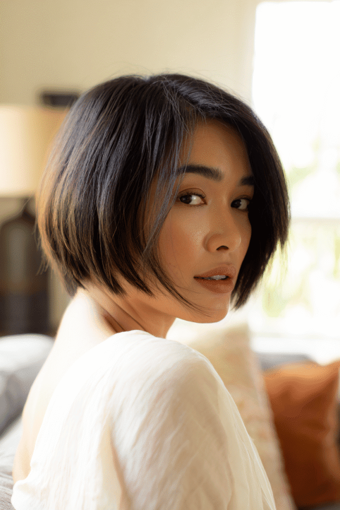 12. Dark Espresso Chin-Length Bob with Side Swept Layers