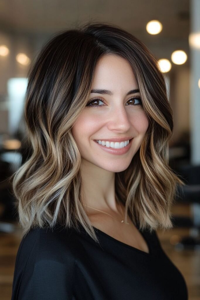 13. Soft Wavy Lob with Dark Roots and Caramel Blonde Balayage