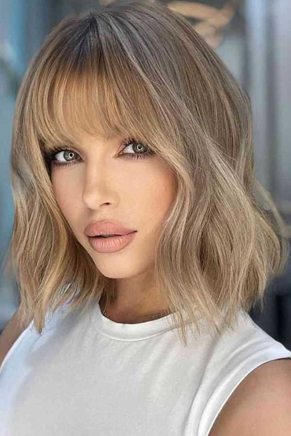 13. Textured Honey Blonde Wave Lob with Straight Full Fringe