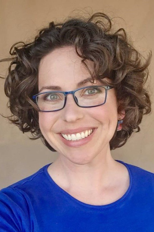 14. Curly Dark Brunette Bob with Volume and Glasses
