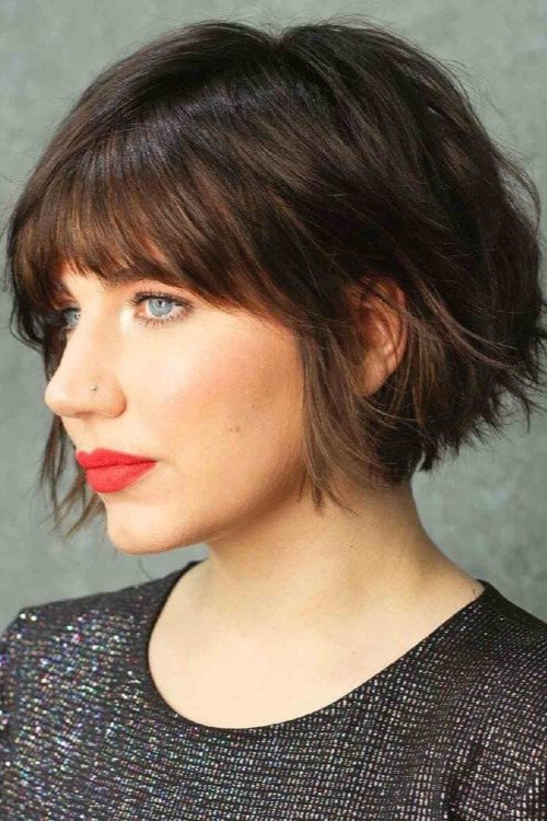 14. Textured Dark French Bob with Thick Straight-Across Fringe