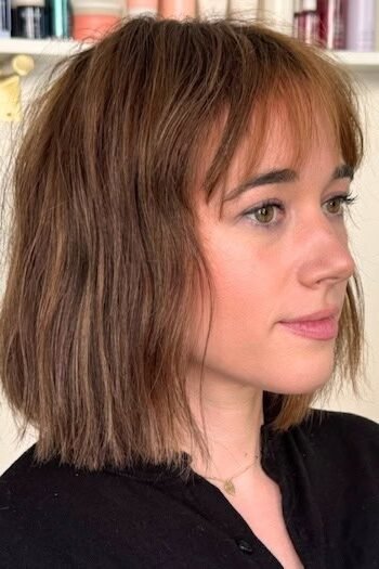 14. Tousled Chestnut Brown Lob with Full Fringe Bangs