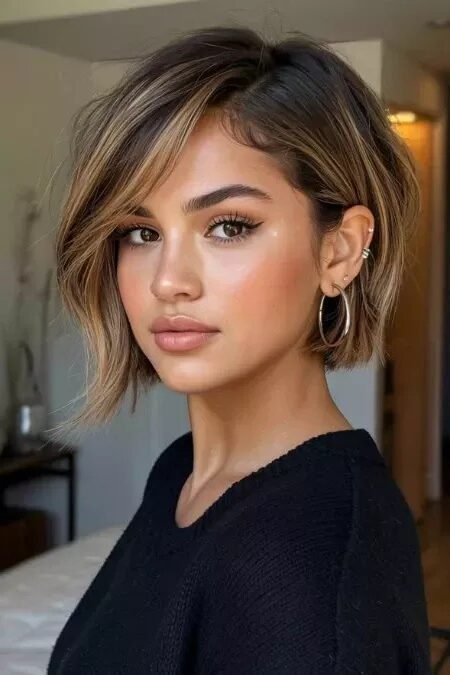 15. Side-Parted Asymmetrical Warm Brown Bob with Honey Blonde Highlights