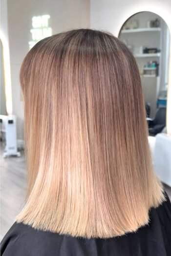 15. Straight Strawberry Blonde Blunt-Cut Lob