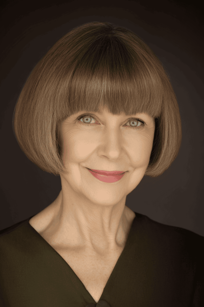16. Sleek Rounded Light Brown Bob with Full Blunt Bangs