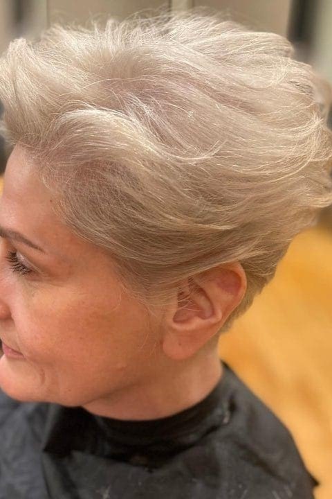 16. Swept-Back Silver Pixie Cut with Soft Crown Texture