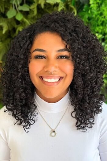16. Voluminous Black Curly Lob with Center Part