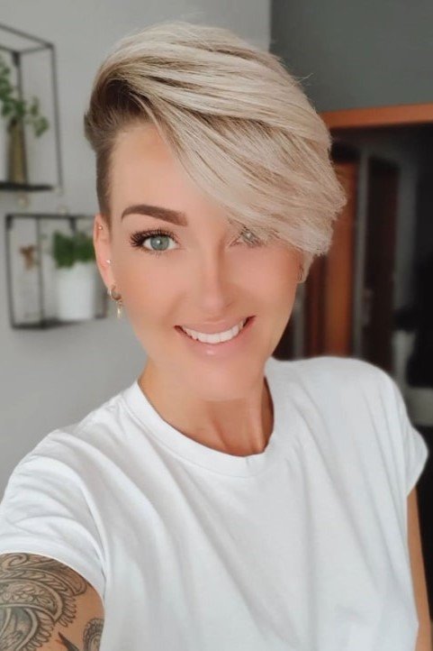 17. Platinum Blonde Asymmetrical Undercut Pixie with Side-Swept Fringe