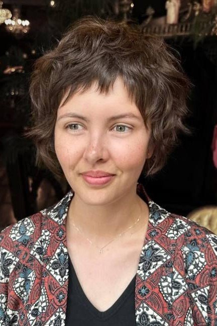 17. Wavy Dark Shag Cut with Micro Fringe