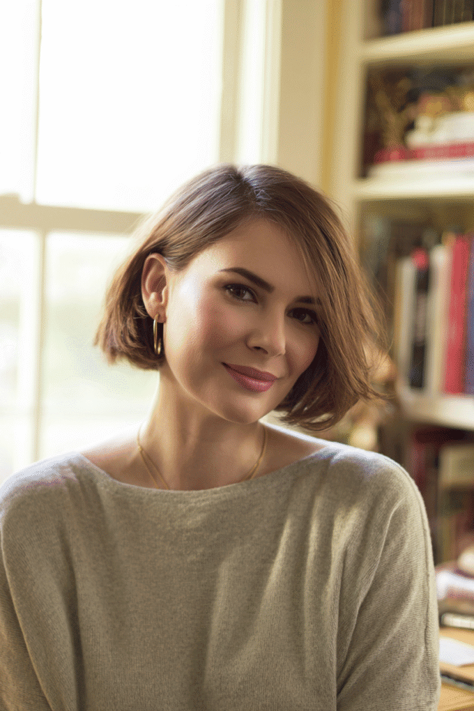 18. Smooth Side-Parted Soft Brown Chin-Length Bob