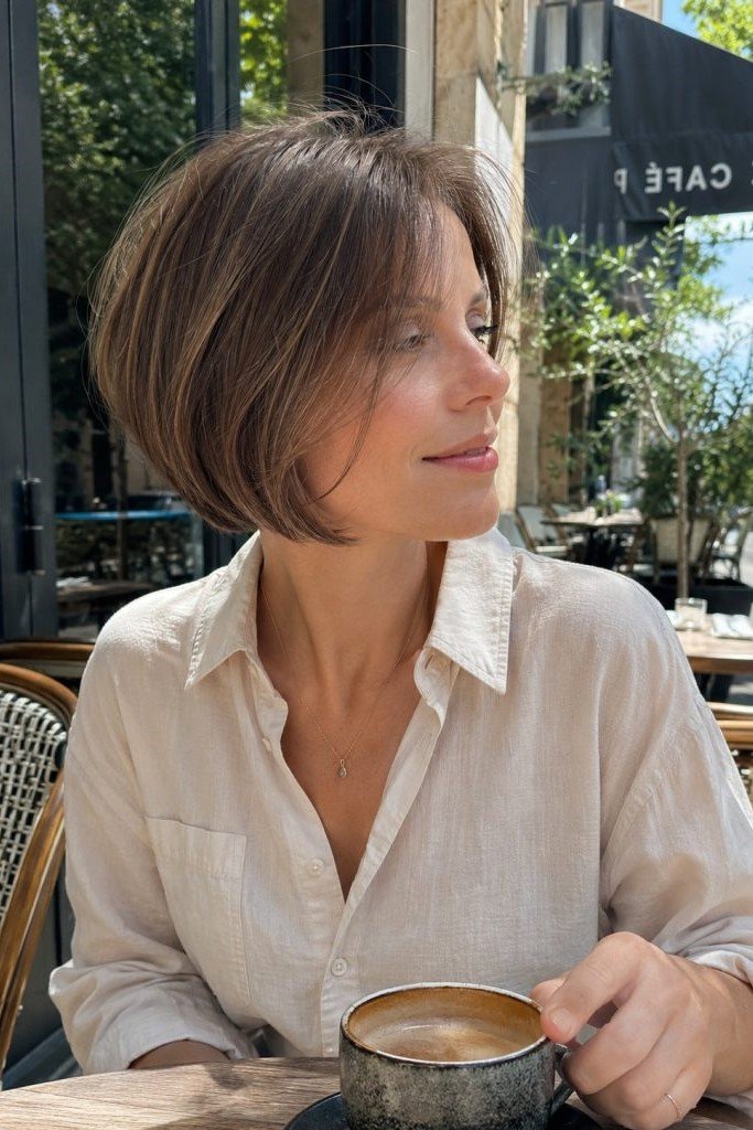 18. Smooth Side-Swept Rounded Bob with Soft Inverted Layers