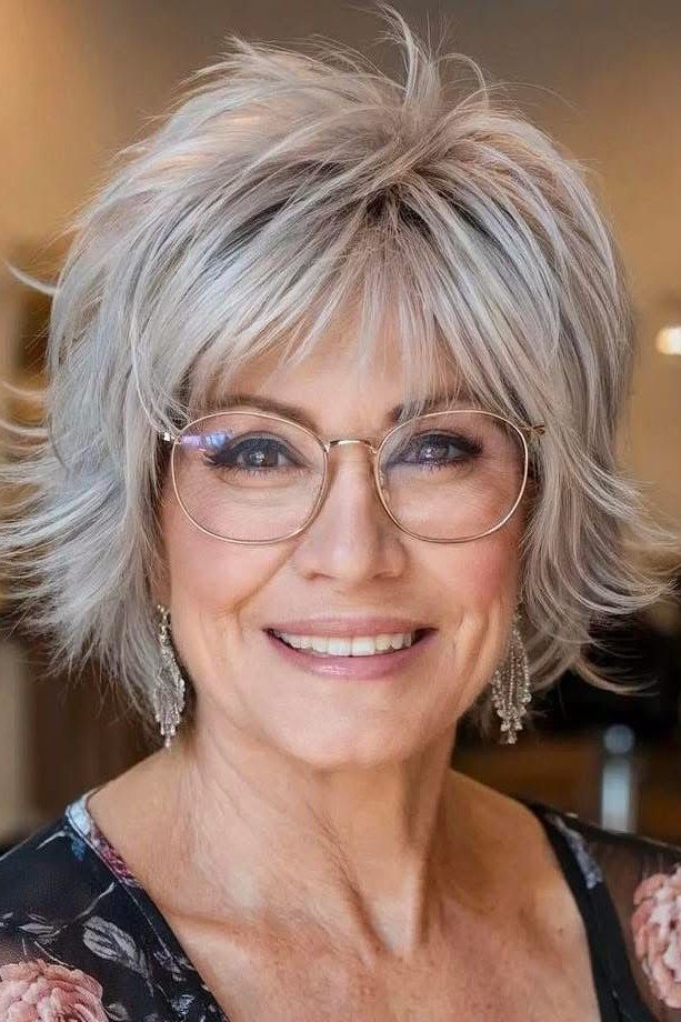 18. Voluminous Silver-Gray Shag Cut with Flicked Layers and Full Fringe