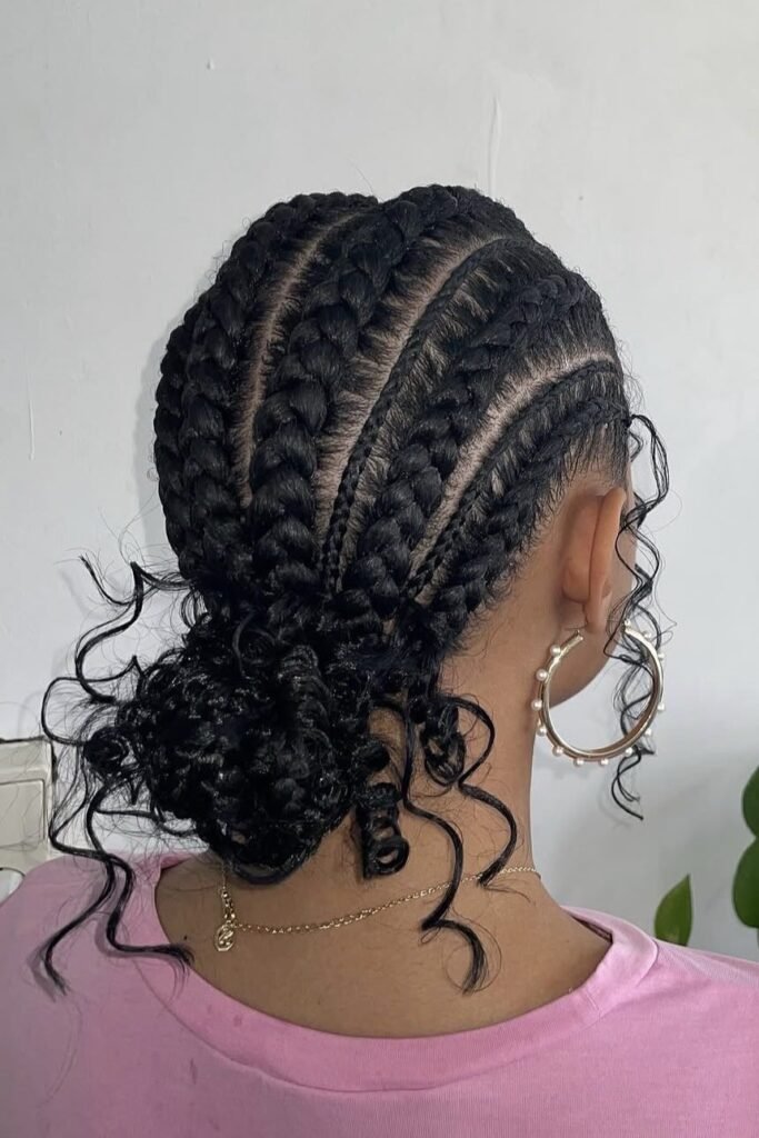 19. Thick Feed-In Stitch Braids into Low Curly Bun