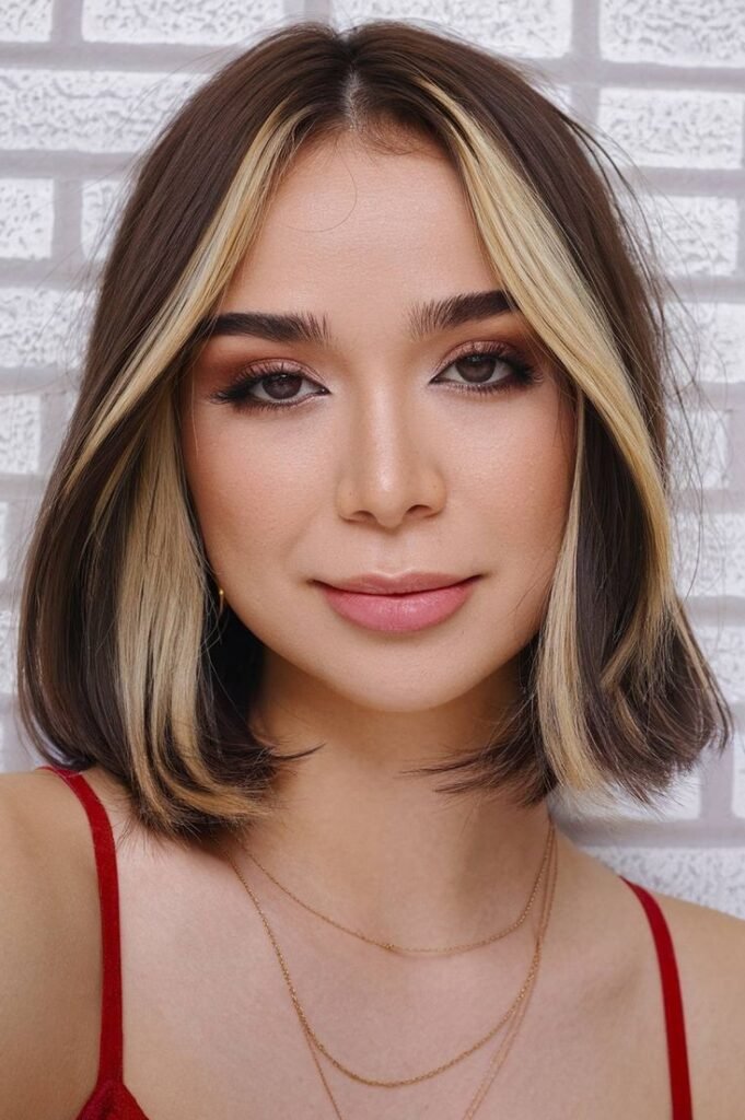 2. Blunt Cut Brunette Bob with Blonde Face-Framing Money Piece
