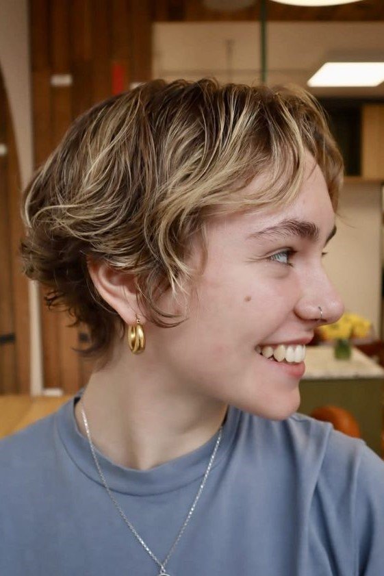 2. Short Layered Pixie Cut with Soft Swept Fringe