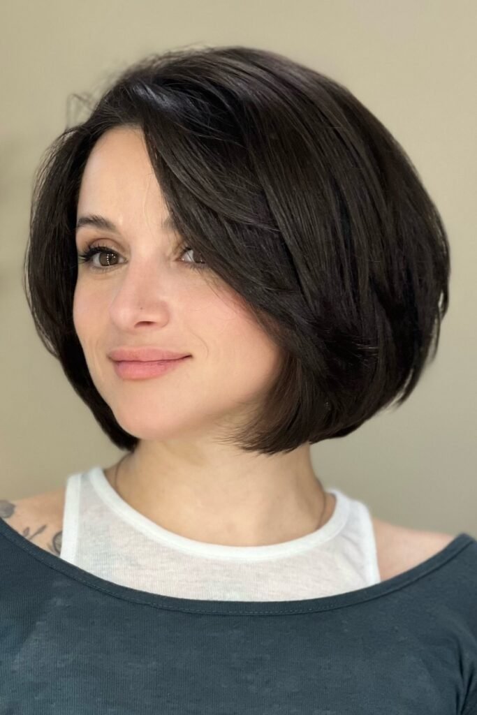 2. Side-Swept Dark Brown Rounded Bob