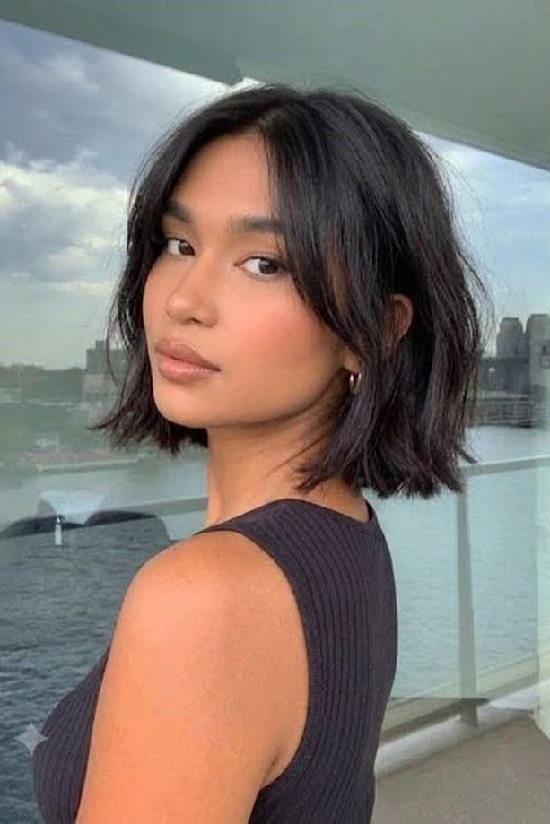 20. Blunt Cut Short Textured Bob with Center-Parted Curtain Bangs