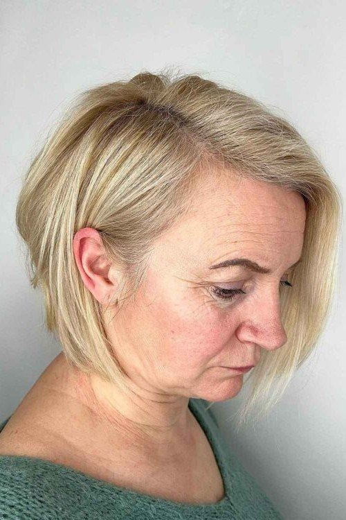 20. Platinum Blonde Asymmetrical Angled Bob with Deep Side Part