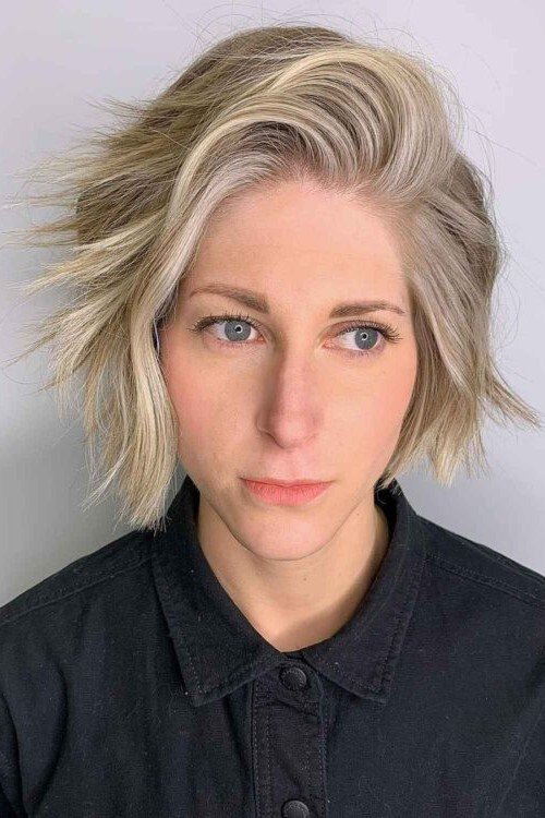 3. Edgy Platinum Blonde Choppy Bob with Swept Volume