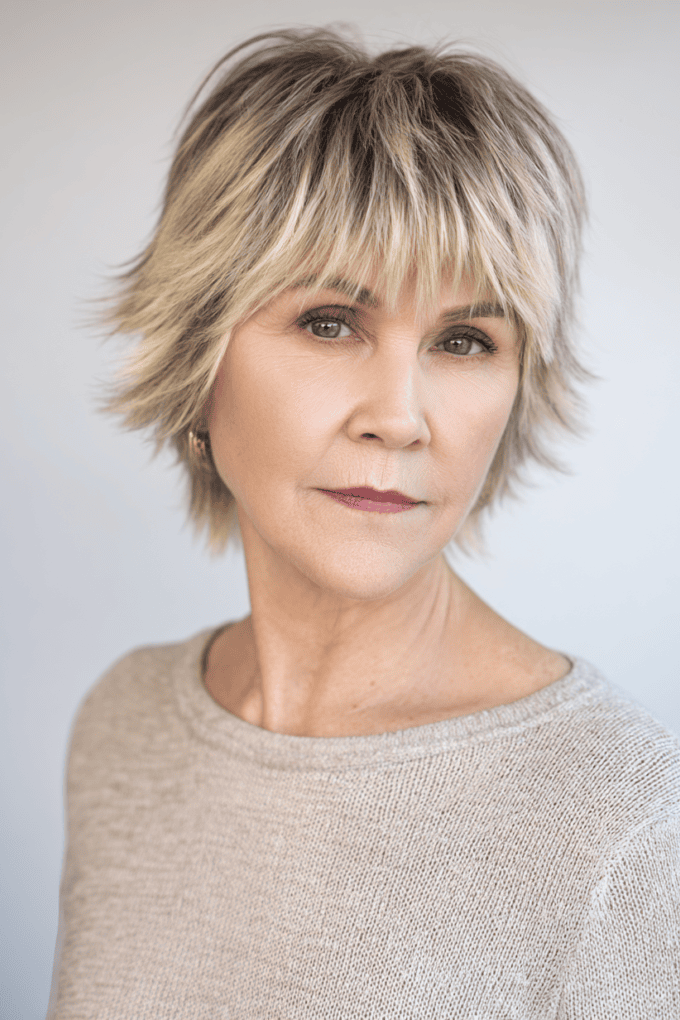 3. Layered Ash Blonde Pixie Shag with Wispy Bangs
