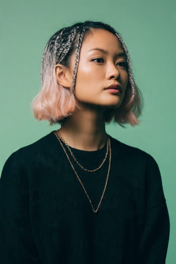 4. Pastel Pink Bob with Crown Accent Braids