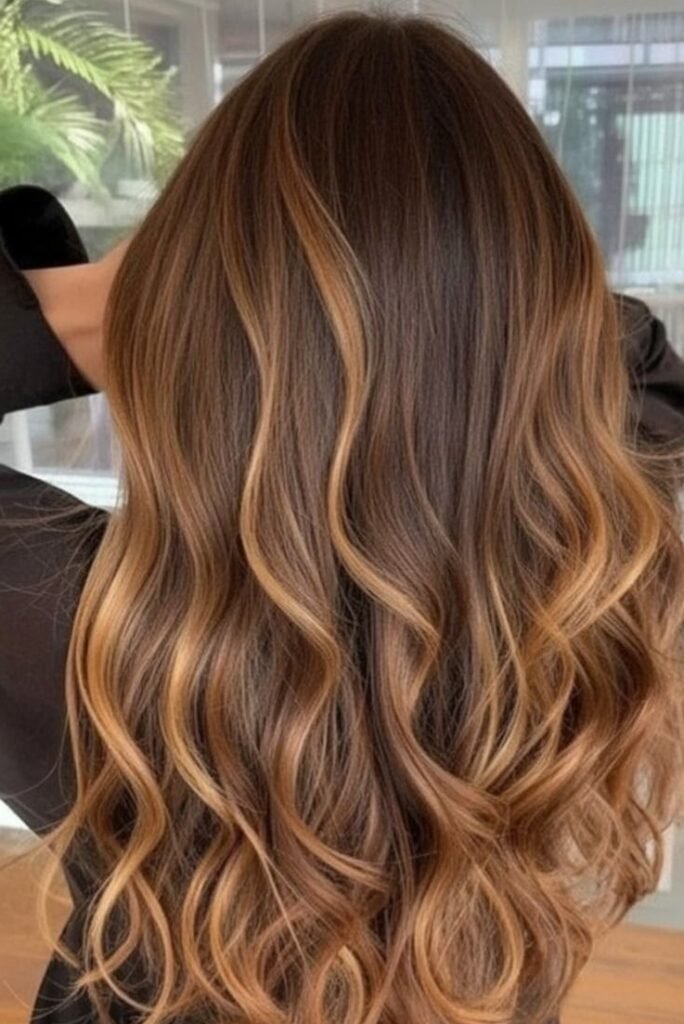 4. Soft Golden Brown and Copper Balayage on Loose Waves