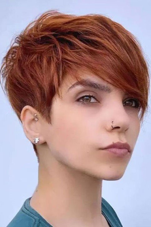 4. Textured Auburn Pixie Cut with Side-Swept Bangs