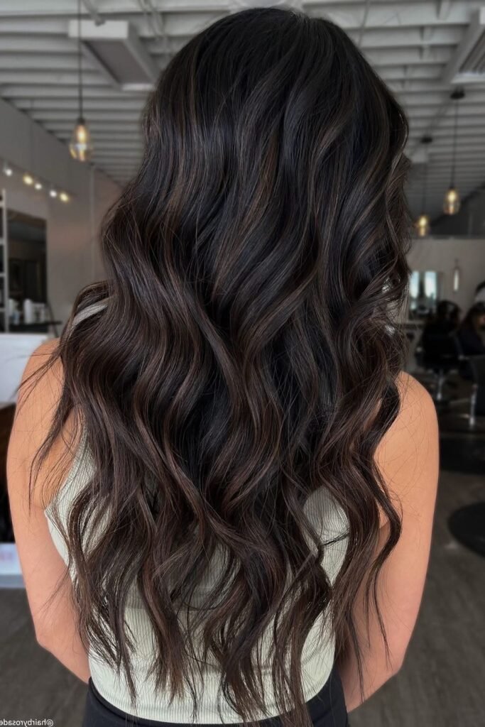 5. Dark Charcoal Brunette Hair with Subtle Cool-Toned Balayage Waves (Back View)