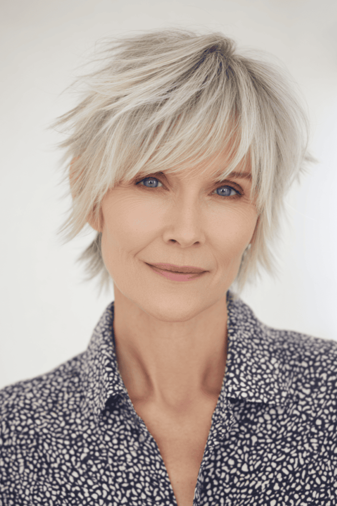5. Platinum White Spiky Pixie Shag with Side-Swept Fringe