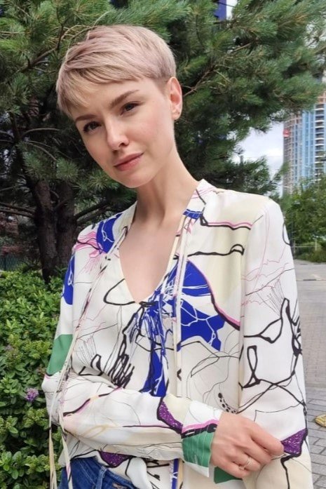 5. Soft Rose Blonde Pixie Crop with Straight Bangs