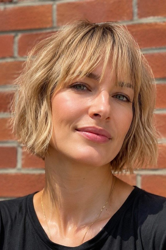 6. Golden Blonde Shaggy French Bob with Fringe Bangs