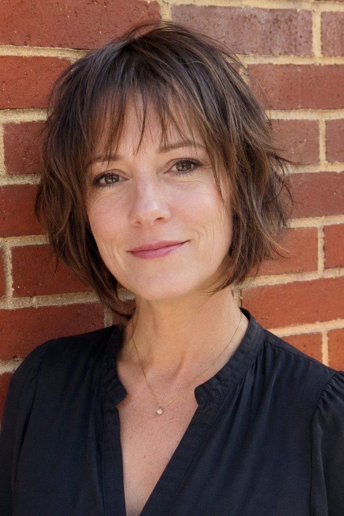6. Shaggy Dark Brunette Bob with Wispy Fringe Bangs