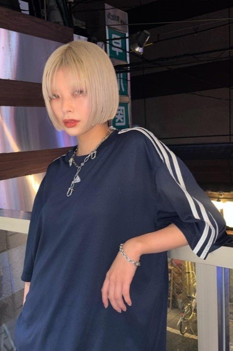 7. Platinum Blonde Blunt Bob with Wispy Curtain Bangs