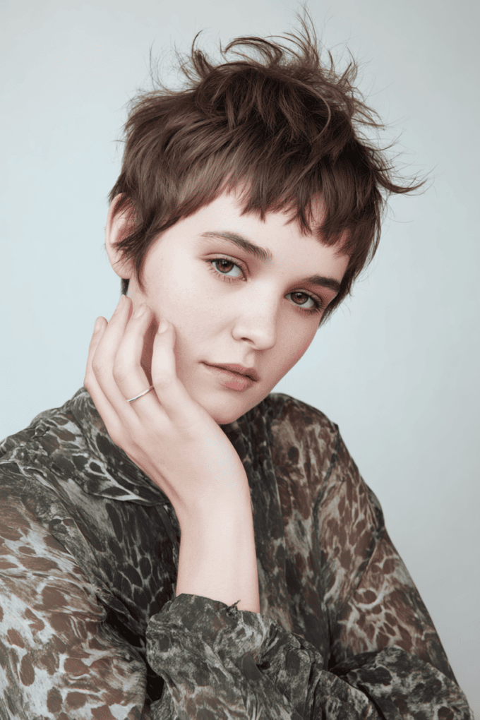 7. Tousled Dark Brown Pixie Cut with Short Choppy Bangs