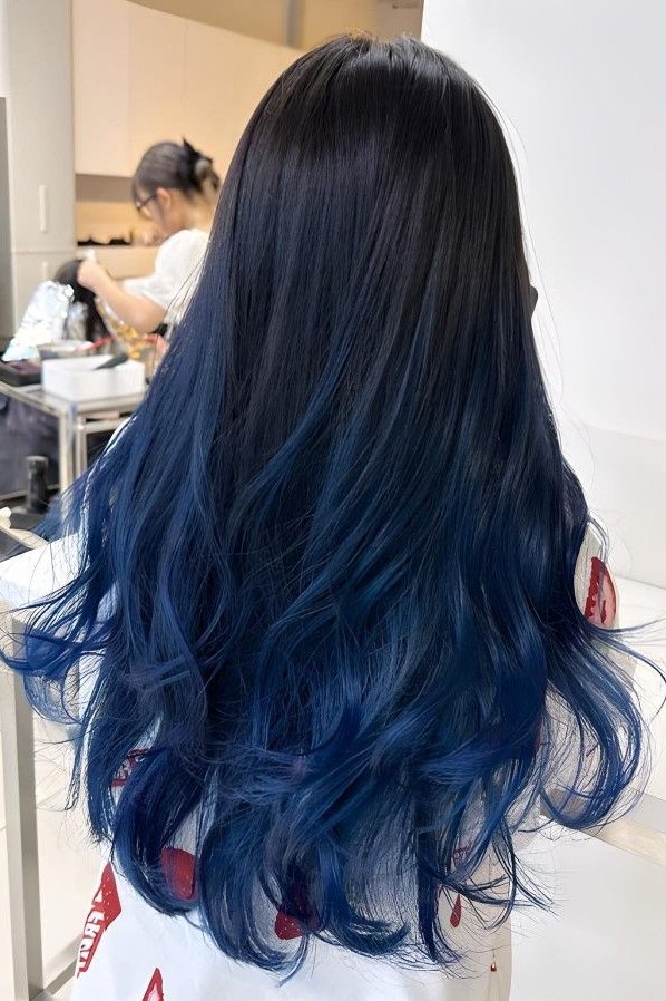8. (Voluminous Layered Brunette Hair with Muted Slate Blue Balayage)