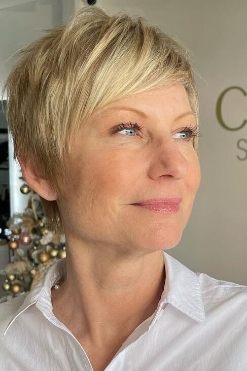 9. Tapered Blonde Pixie with Side-Swept Bangs