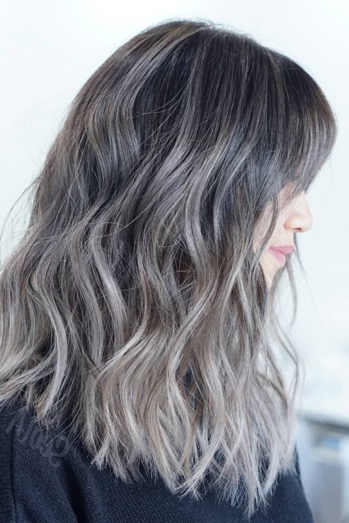 10. Ash Blonde Layered Bob with Silver Lowlights