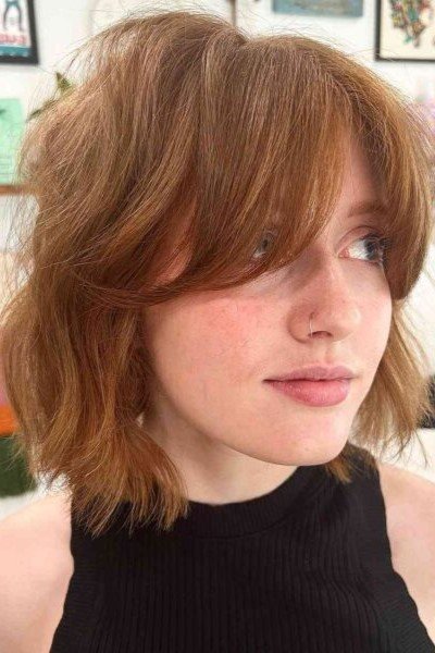 10. Warm Copper Wavy Shag Cut with Soft Layered Curtain Fringe