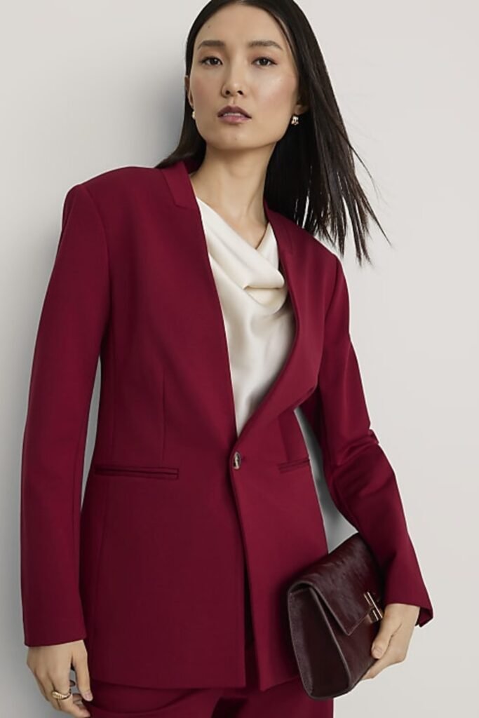 17. Rust Coat with Black Dress and Knee-High Boots