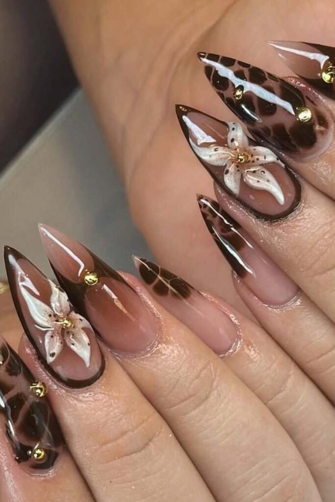 19. Burgundy and Gold Foil Aura Accent Nails