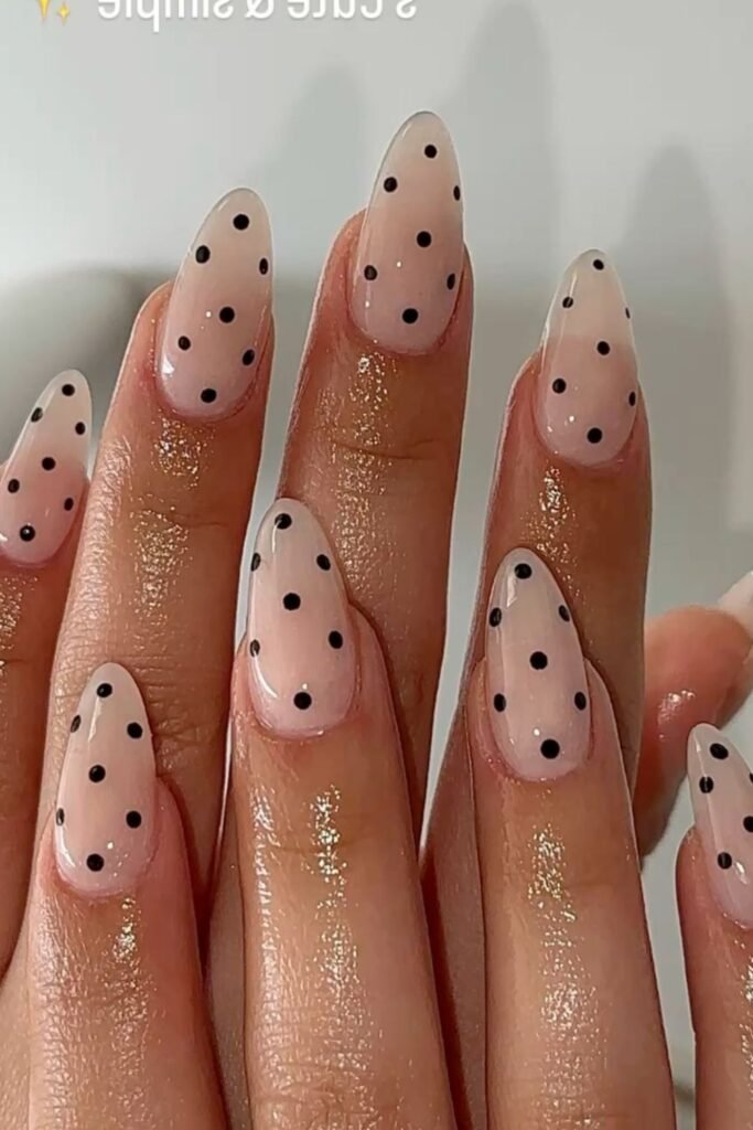 2. Sheer Nude Nails with Black Dots