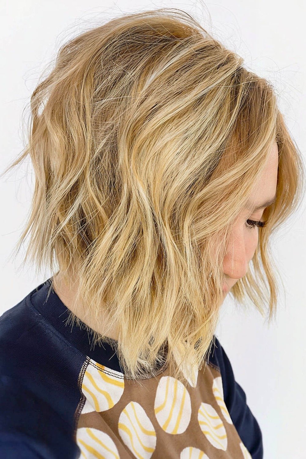 2. Sleek Short Brunette Bob Tucked Behind the Ear
