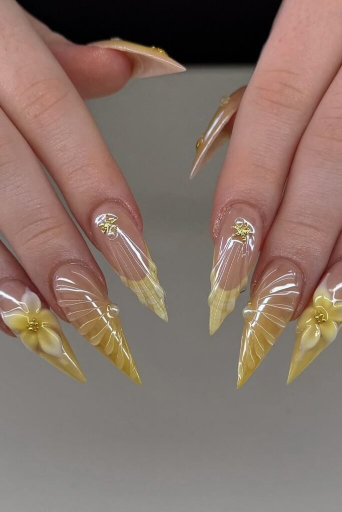 20. Translucent Yellow Seashell Stiletto Nails