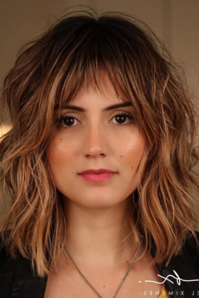 3. Strawberry Blonde Shag with Rooted Bangs