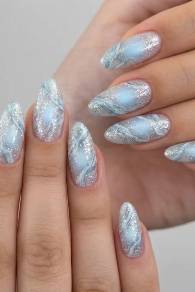 4. Dusty Blue Pearl Chrome Almond Nails