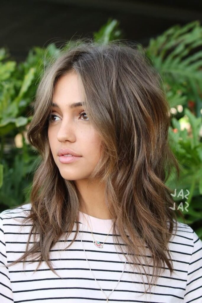 5. Ash Blonde Razor Shag with Wispy Bangs