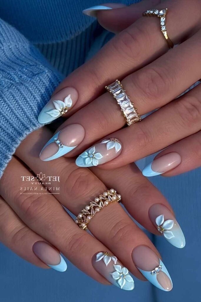 5. Blue Pearl Nails with Silver Bow Charms