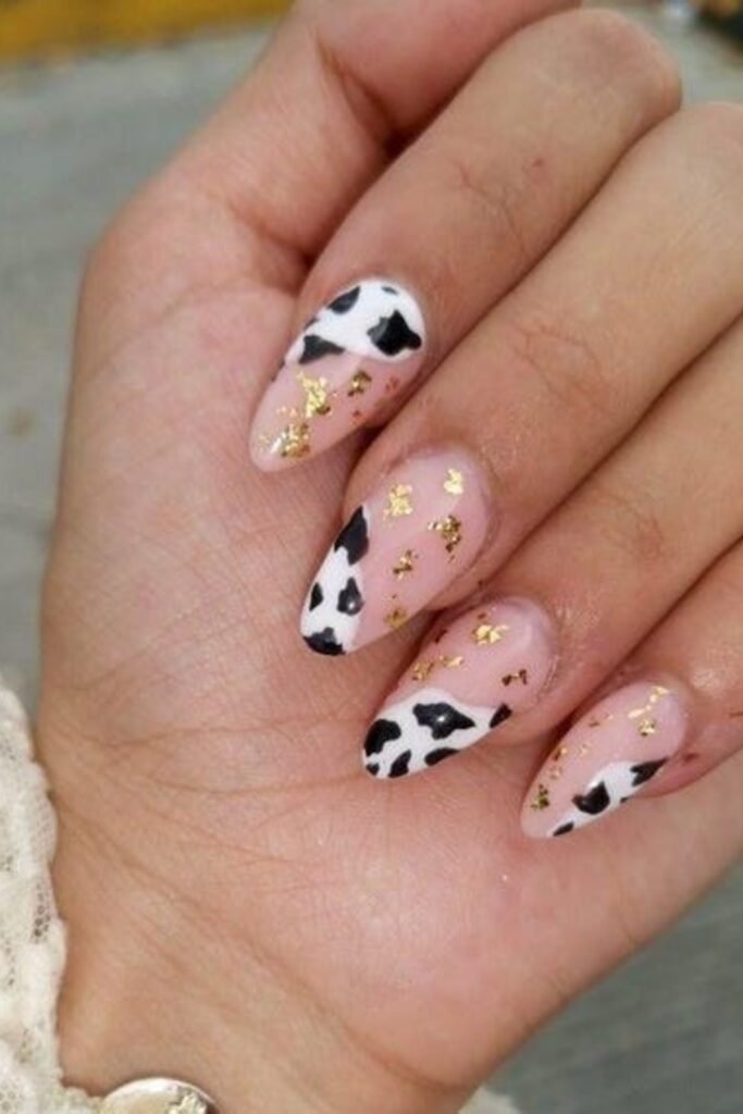 5. Cow Print French Tips with Heart Cutouts